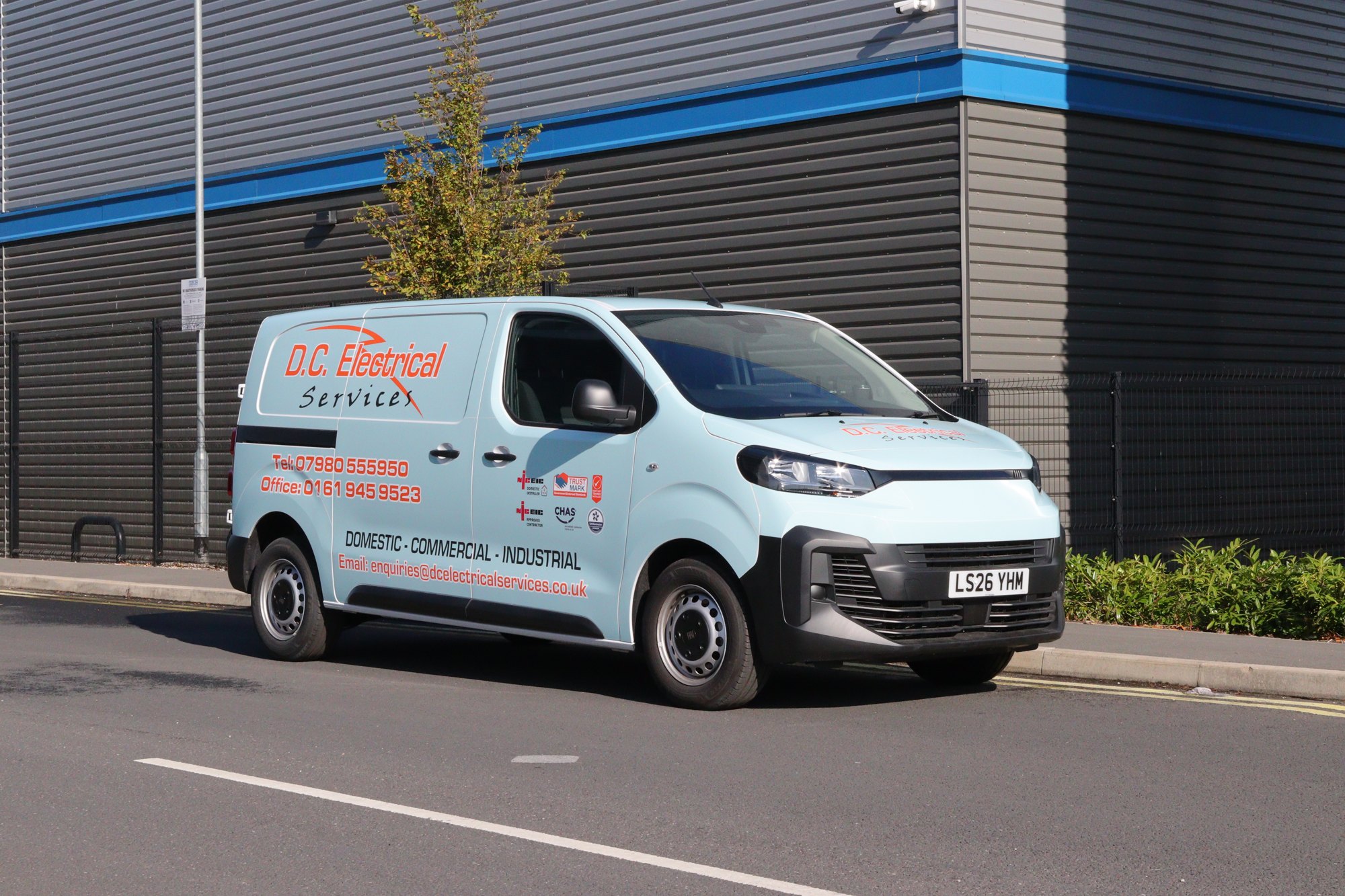 DC Electrical Services van with printed graphics and contact details, Auto Wrap Manchester
