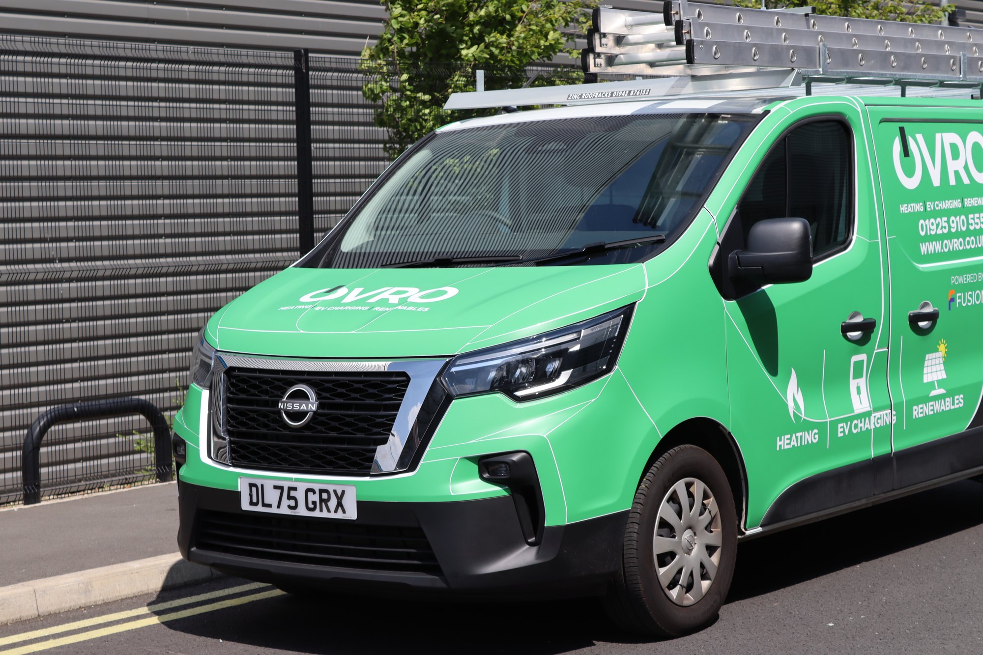 OVRO Nissan Primastar in a full green printed van wrap by Auto Wrap Manchester