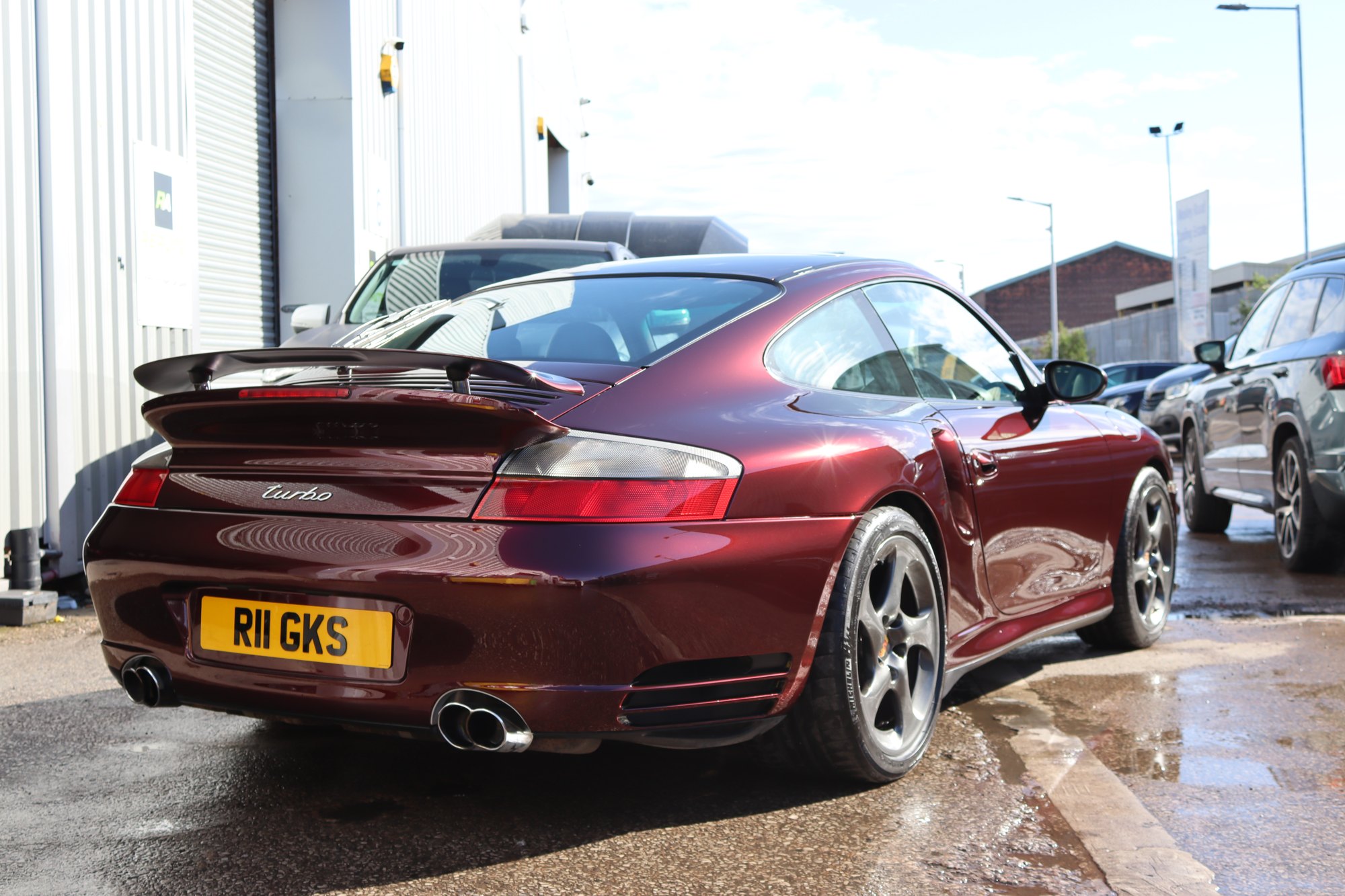 Rear view of a Porsche 996 Turbo finished in red colour PPF, Manchester
