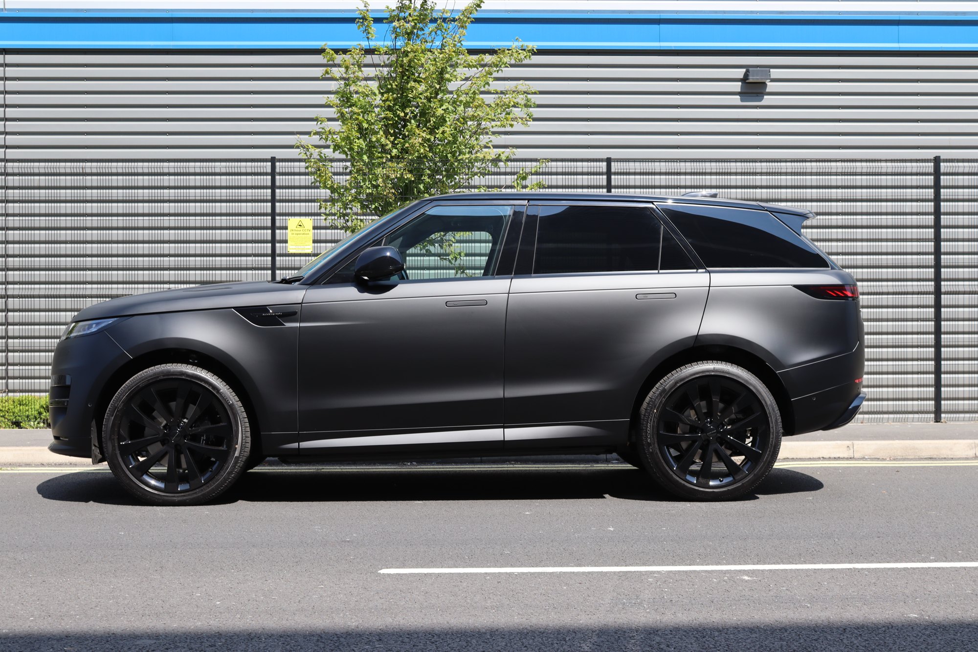Range Rover Sport in a satin black full wrap with black pack, side profile, Auto Wrap Manchester