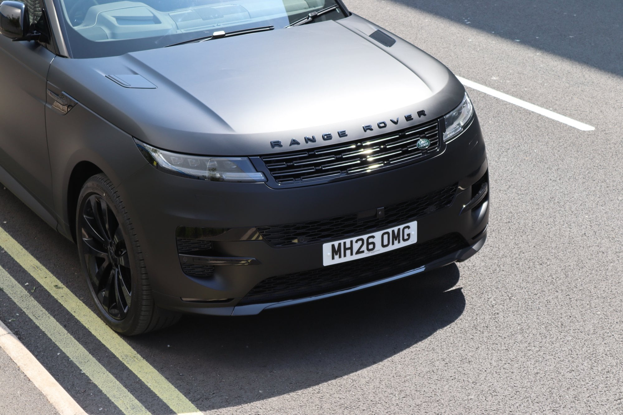 Range Rover Sport wrapped in satin black with blacked-out badges and grille, Auto Wrap Manchester