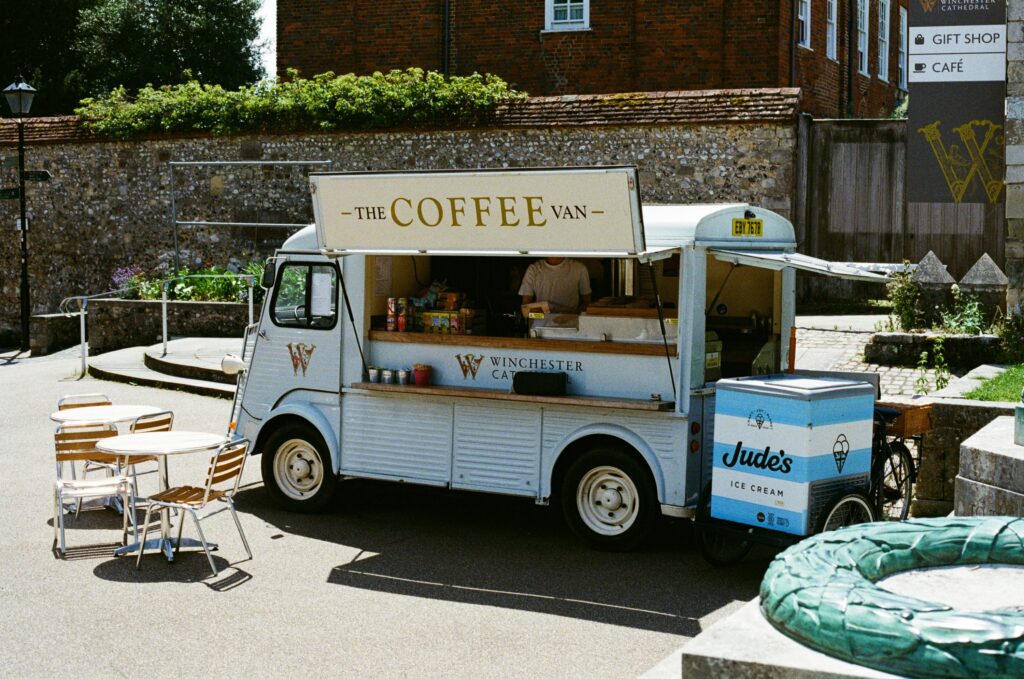 Coffee van in a printed livery with outdoor seating